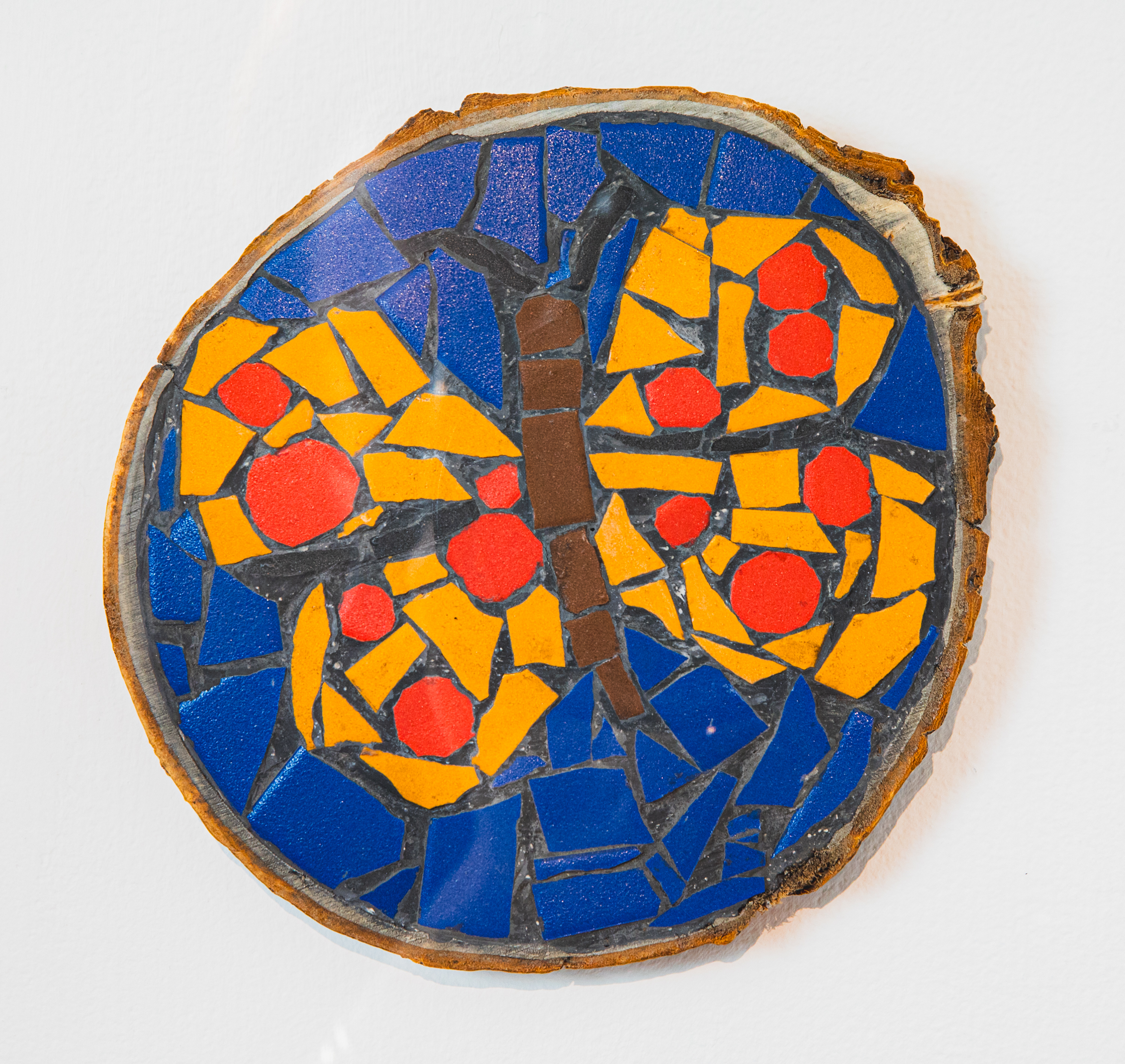 Papillon sur rondelle de bois